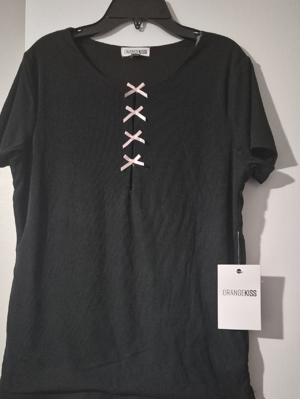 ORANGEKISS Black Ribbed Tee with Pink Bow Accent